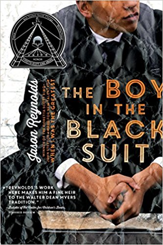 the boy in the black suit